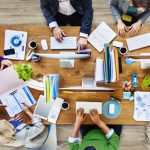 Top down view of a conference table with a business meeting in progress