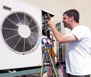 Man working on HVAC unit