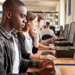 young man using a lab computer