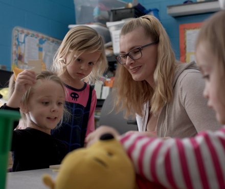 VGCC Early Childhood student working in a classroom with very young children in