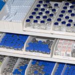 Racks of empty medicine bottles in the pharmacy lab