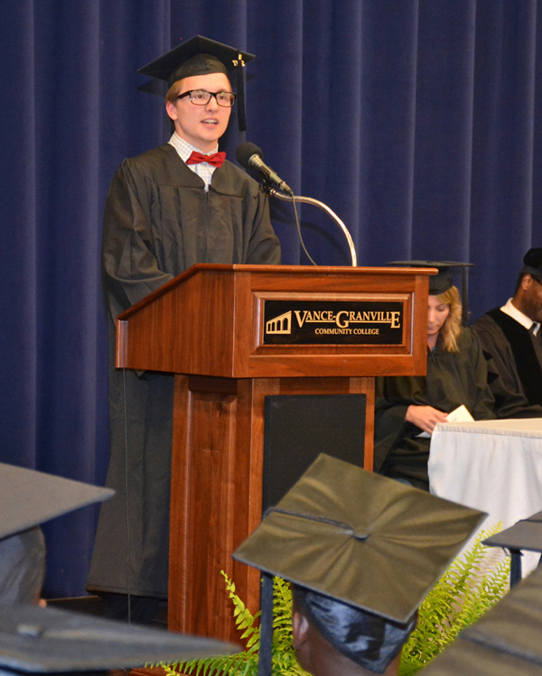 Spencer Bojan Boyd, at podium, addresses his fellow VGCC Adult Basic Skills graduates.