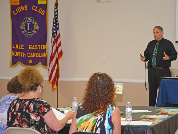 Martin Brossman (right) addresses participants at the Small Business Summit.