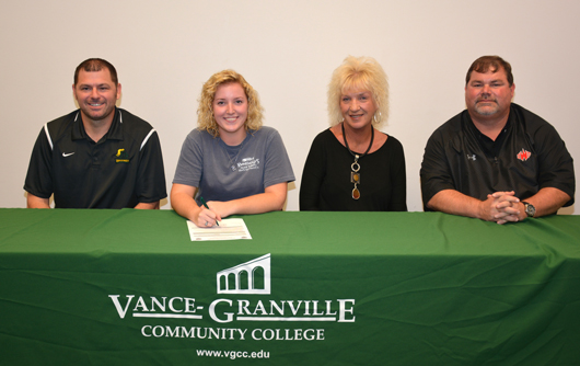 Allyson Cash of Grassy Creek (second from left) signs her letter of intent to join the women’s volleyball team at Vance-Granville Community College. Joining her are, from left, VGCC Coach Christopher Young, her mother, Rhonda Cash, and Rick Givens, athletic director at J.F. Webb High School. (VGCC photo)