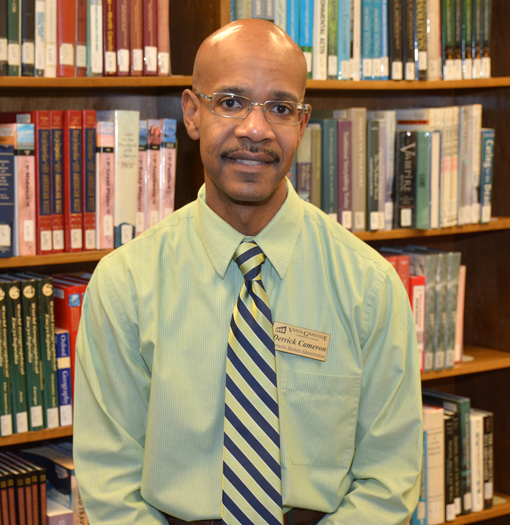 Derrick Cameron, a VGCC Business instructor, is seen here in the library on the college’s Main Campus in Vance County.