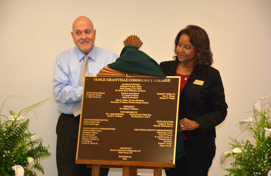 VGCC Dean of Continuing Education Dale Fey (left) and Dean of Business & Applied Technologies Angela Gardner-Ragland (right) unveil the dedication plaque for Building 10 during the Aug. 3 ceremony. 