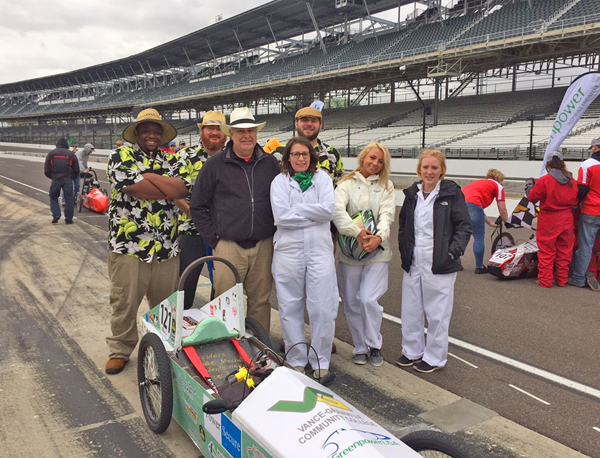 From left, VGCC team members Jerry Pierce, Jr., Kyle Painter, Keith Shearon, Jessica Baker, Thomas Boyd (in back), Alexa Clayton and Olivia Williamson gather on the track at Indianapolis Motor Speedway.