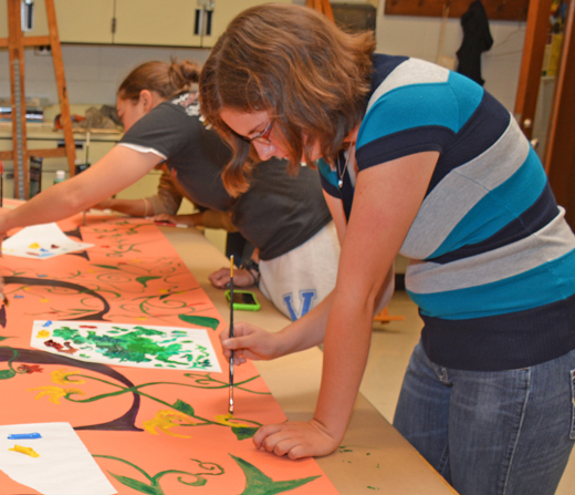 VGCC student Jessie Hartley of Oxford works on a mural during VGCC’s first “Fine Arts Day” event.