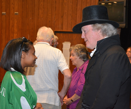 Photo of VGCC student Latessa Wilkerson of Henderson talking with “Thomas Jefferson” (Bill Barker) at the conclusion of his lecture at the college.