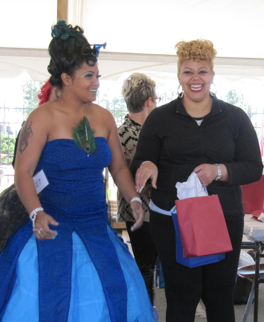 Jalishia Boyd (left) serves as the model for her sister, Kierra Richardson (right), for the “Fantasy Hair & Makeup” design that won Richardson fourth place at the North Carolina State Fair.