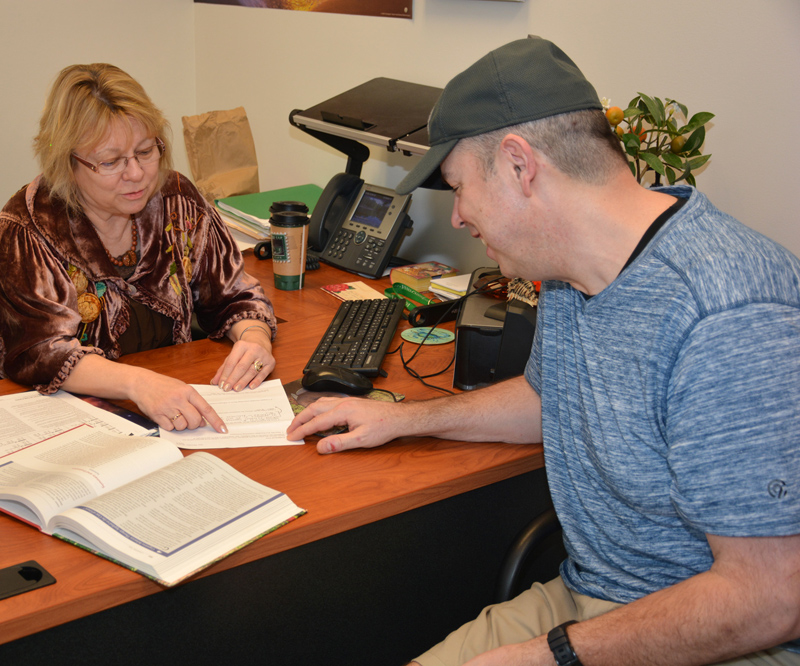 VGCC Academic Skills Center tutor Tina Moll (left) discusses an assignment with student Robert Dow in Moll’s office on the college’s South Campus. Dow said that Moll “has been great all-around,” patiently helping him with his English course work and forming one of his links in a “chain” of support at the college.