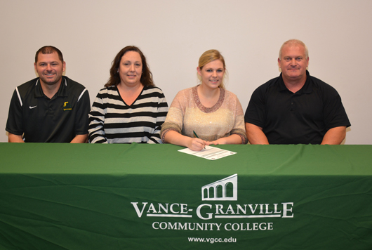 Kristen Senter of Franklinton (third from left) signs her letter of intent to join the women’s volleyball team at Vance-Granville Community College. Joining her are, from left, VGCC Coach Christopher Young, her mother, Tina Moody and her father, Chris Senter. (VGCC photo)