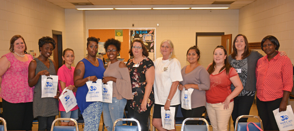 From left, Well Care Human Resources Recruiter Kendra Dillingham, VGCC Practical Nursing students Christine Atenio, Frances Beddingfield, Kristen Clay, Antonea Nowell, Well Care Clinical Coordinator Mary O’Shea, students Amy Bass, Mariana Ascencio, Christina Basnight, Well Care Communications Manager Jennifer Cascio and student Veronicah Nykego. 