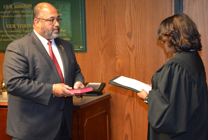 Xavier Wortham of Oxford, left, is sworn in as a newly appointed member of the VGCC Board of Trustees by Ninth Judicial District Court Judge Carolyn J. Thompson at the board’s meeting on Nov. 20. 