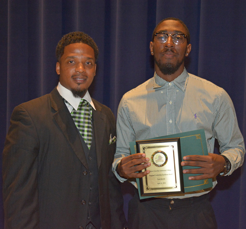 From left, VGCC Men’s Basketball Coach DeMarcus Oliver presents the Vanguard Leadership Excellence award to Tyrek Beverly of Oxford. 