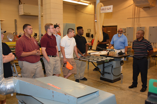 Employer John Terry of Raleigh (right) talks about job opportunities with students from Warren County High School during the open house at VGCC. Terry is a 1988 graduate of the Carpentry program. 