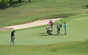 Golfers on the green at Henderson Country Club