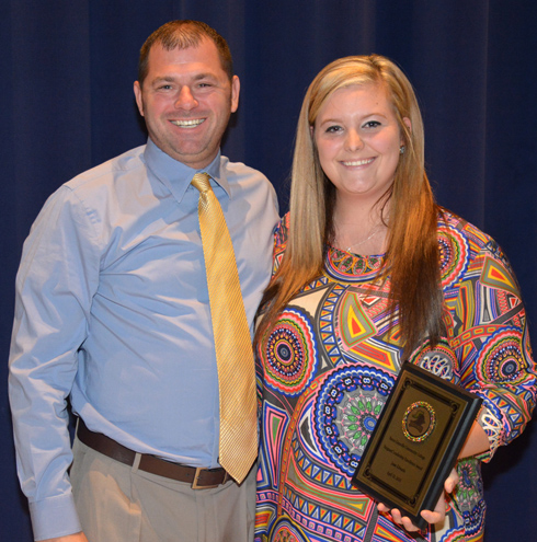 From left, VGCC Women’s Volleyball Coach Christopher Young presents the Vanguard Leadership Excellence Award to Jesse Edwards of Henderson.