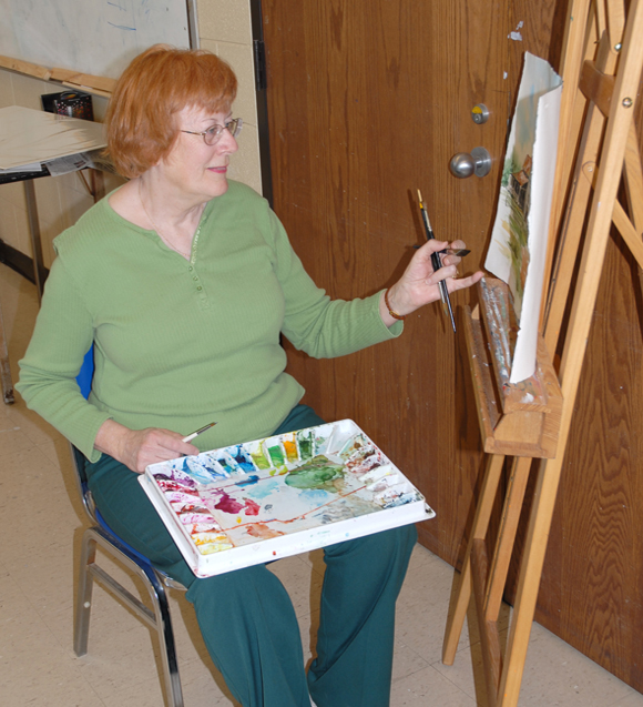 Late-2000s picture of Lelia Brigham painting at VGCC.