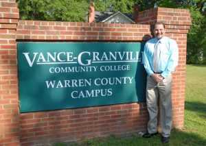 Mitch Evans standing in front of VGCC Warren Campus Sign