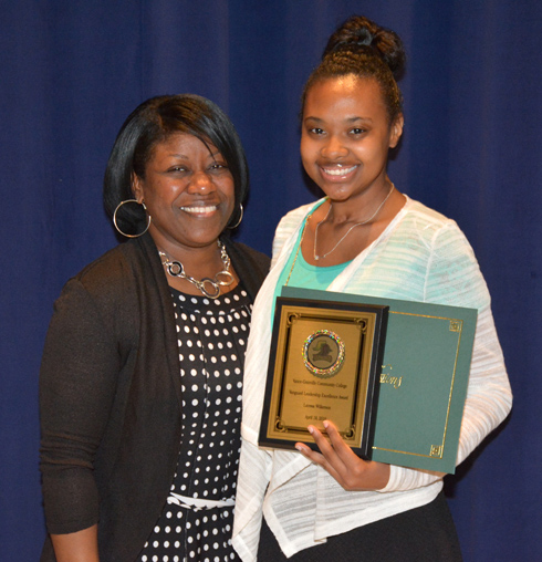 From left, VGCC Vanguard Spirit Pep Squad advisor Tina Ragland presents the Vanguard Leadership Excellence award to Latessa Wilkerson of Henderson. 