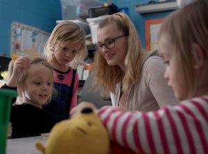 VGCC Early Childhood student working in a classroom with very young children