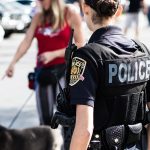 Officer helping pedestrian on the street