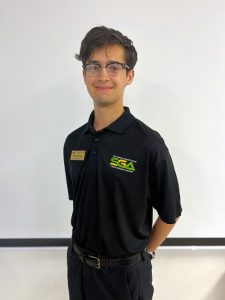 Ethan Perez smiling while wearing a Student Government Association Polo.