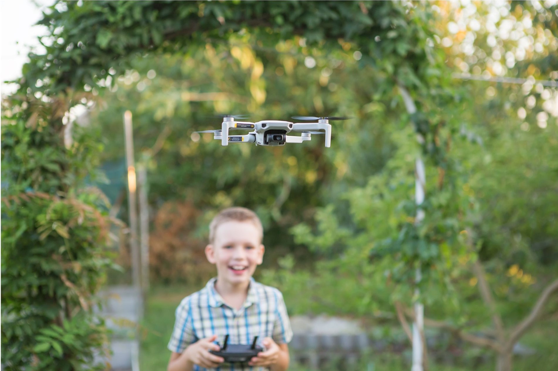 Young boy flying a Drone